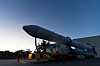 The Nuri rocket rests horizontally on a transporter at dusk during preparations for its fifth launch.