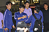 Korean footballers Hwang In-beom, center, and Kim Min-jae, third from left, are seen after their arrival at Incheon International Airport on June 30.