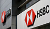 Two HSBC logos are displayed on an office building overseas on July 25, 2025.