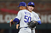 Los Angeles Dodgers shortstop Kim Hye-seong, right, and shortstop Mookie Betts celebrate after defeating the Atlanta Braves at Truist Park in Georgia on Oct. 7.