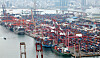 Containers of export and import cargo are stacked high at terminals in Busan Port on Oct. 1.