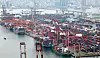 Containers of export and import cargo are stacked high at terminals in Busan Port on Oct. 1.