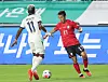 Korean midfielder Song Min-kyu, right, chases a ball during a friendly match against Ecuador in Suwon, Gyeonggi, on Sept. 24.