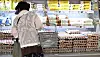 A shopper browses refrigerated shelves stocked with domestically produced fresh eggs in a supermarket in Seoul on July 17.