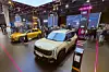 The hybrid version of Kia K4, left, and Seltos SUV are displayed at the Paris Motor Show 2026