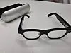 Smart glasses used by Kim Yun-hwan. The glasses cost around 800,000 won ($600). A fingernail-sized camera at the tip of one temple reads questions and projects answers onto the transparent lenses.