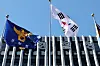 The Korean flag and flag for the National Police Agency are seen in Seodaemun District, western Seoul, on Oct. 2.