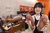 A person holds baked sweet potato at Emart 24 store.