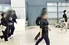 Two suspects of running illegal gambling sites from overseas arrive in Korea via Incheon International Airport on Oct. 14.