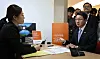 Financial Services Commission Chairman Lee Eog-weon, right, subscribes to a service that allows living-policy holder to receive claims for life insurance's policy during their lifetime on Oct. 30, 2025.