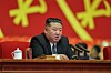 North Korean leader Kim Jong-un speaks during the regime's gathering on Sept. 21, in a photo carried by Rodong Sinmun.