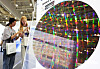 Visitors observe semiconductor-related products and technologies at an exhibition held in Suwon, Gyeonggi, on Aug. 26.