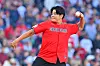 Choo Shin-Soo, former player for the Cleveland Guardians, throws the ceremonial first pitch ahead of the Guardians taking on the Tampa Bay Rays during the American League Championship Series at Progressive Field on Oct. 18.