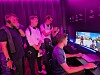 Visitors try out games on Samsung Electronics' organic light-emitting diode-made gaming monitors at the company's exhibition booth in Berlin on Sept. 3.