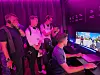Visitors try out games on Samsung Electronics' organic light-emitting diode-made gaming monitors at the company's exhibition booth in Berlin on Sept. 3.
