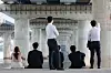 Office workers are seen beneath a bridge in Han River in western Seoul on May 18.