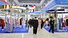 Kim Jong-un, center, as well as his daughter and officials visits the Garment and Footwear Exhibition in Pyongyang on Oct. 19, in a footage carried by Korean Central Television on Oct. 20.