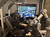 This reporter, wearing an extended-reality headset, examines the virtual interior of a car at the Technocentre’s XR Innovation Lab during a visit to Renault’s research center in Guyancourt on Oct. 12.