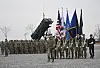 Members of the United Nations Command honor guard carry flags during a change-of-command ceremony for the United Nations Command, Combined Forces Command, and the United States Forces Korea at Camp Humphreys in Pyeongtaek, Gyeonggi, on Dec. 20, 2024.