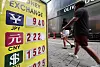A person walks by a private currency exchange booth in Seoul on July 5.