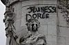 Tagging reading 'The golden youth' on the statue of Equality at the Republique square, after a quiet night Monday under curfew, the first since weekend protests over the cost of living turned into rioting and looting across France, in Paris, Tuesday, Oct. 20, 2026. (AP Photo/Christophe Ena)