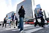Commuters make their way to work at the Gwanghwamun area in central Seoul on Sept. 28.