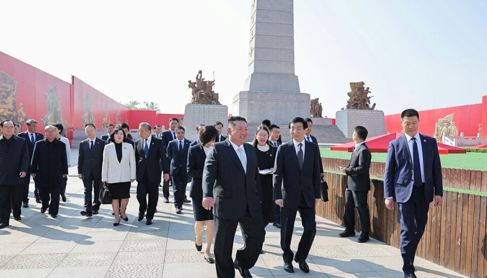 North Korean leader Kim Jong-un, center left, walks with Wang Huning, chairman of the National Committee of the Chinese People’s Political Consultative Conference, center right, in Dandong, China, on Oct. 24, in this