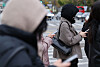 People wearing winter jackets are seen in central Seoul on Oct. 29.