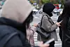 People wearing winter jackets are seen in central Seoul on Oct. 29.